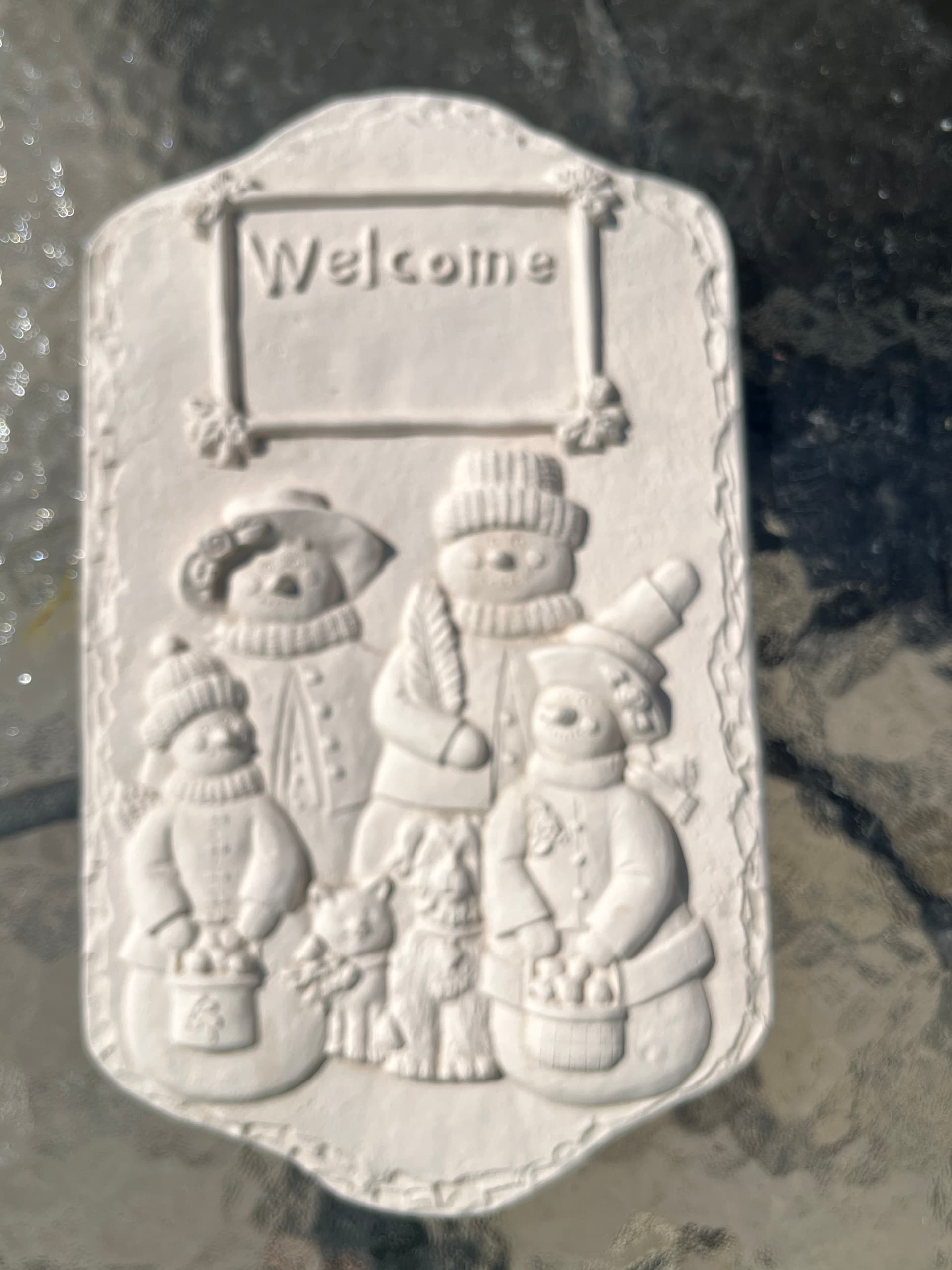 Unpainted Bisque Ceramics: Ceramic bisque snow family plaque. 